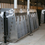 A set of hog feeders in a barn