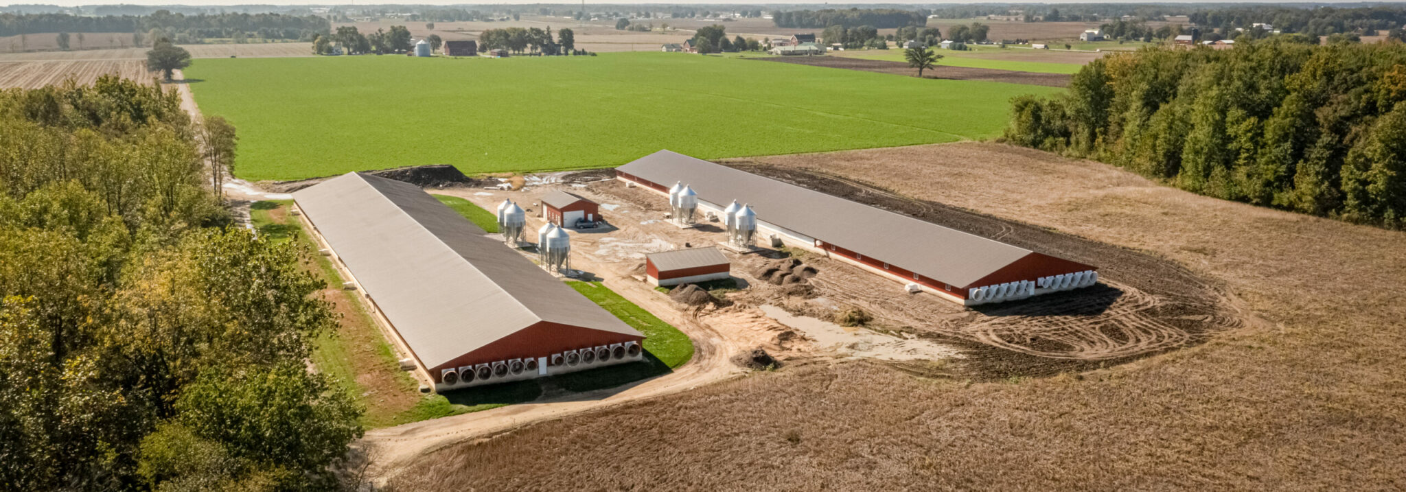 An arial shot of two barns
