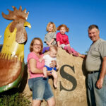 A farming family posing for a picture
