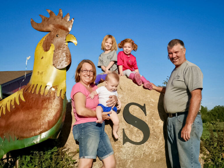 A farming family posing for a picture